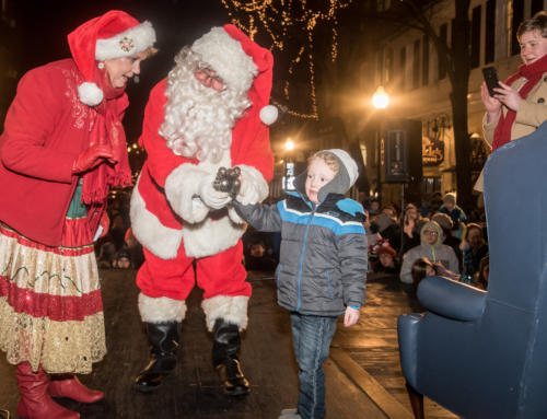 Three-Year Old Breccan Mitchell Helps Santa Light State College Tree